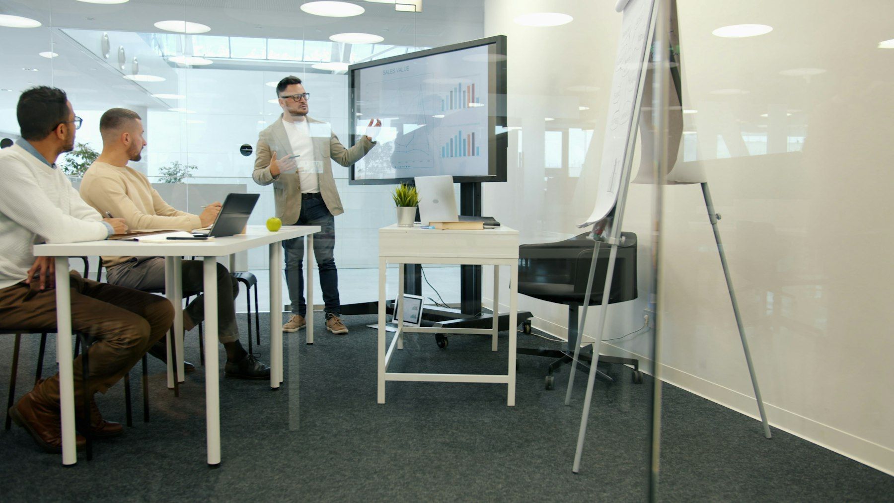 Executive presenting to colleagues in a modern office